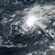 Satellite image of a cyclone where the thickest clouds are displaced from the central vortex