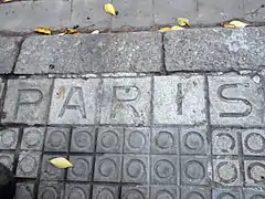 Street name on pavement: calle de París.