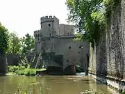 A city gate with its towers, the defensive walls, and the city ditch from the 13th century in Metz, France