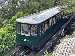 Sixth generation Peak Tram car approaching The Peak Terminus