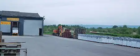 Factory with bagged peat, extraction in the background