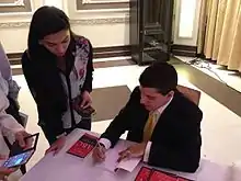 De Abreu at a book signing in Dubai