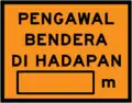 Flagman ahead with distance