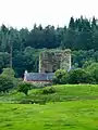 Penninghame Home Farm.  View across fields to the south of the farm towards the remains of Castle Stewart