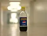 Pepsi-Cola in a plastic bottle.