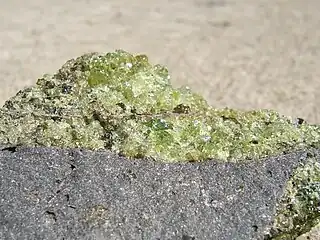 Peridot olivine with minor pyroxene, on vesicular basalt. (field of view = 35 mm)