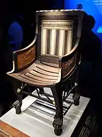 Ancient Egyptian armchair of Tutankhamun; 1336–1326 BC; wood, ebony, ivory and gold leaf; height: 71 cm; Exposition of Tutankhamun Treasure in Paris (2019)