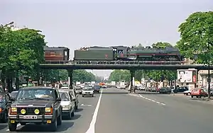 Steam locomotive and train on the cours de Vincennes bridge