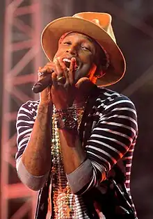 Color picture of singer Pharrell Williams singing at Coachella in 2014.