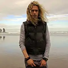 Phil Joel at Piha beach in New Zealand