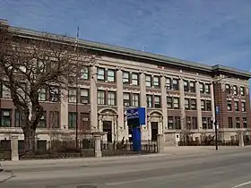 Photograph of a large school building.