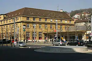 Large four-story stone building with hip roof