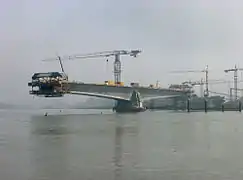 This concrete bridge temporarily functions as a set of two balanced cantilevers during construction – with further cantilevers jutting out to support formwork.