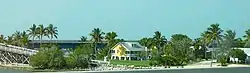 Partial view of Pigeon Key. The old Seven Mile Bridge is shown crossing the island in the background. The exit ramp is shown to the left.