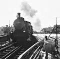 Hv1 No 547 heads an express train from Turku to Helsinki over the River Aura bridge in 1958