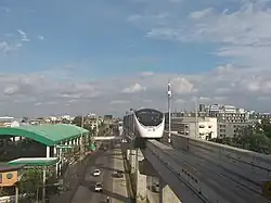 MRT Pink Line skytrain runs above Ram Inthra road in the Min Buri area