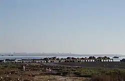 Khniss is a small city in the Tunisian Sahel region. It is located on the coast, 5 km south of Monastir. Its population is estimated at around 11,000 as of 2014.