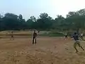 Playing cricket on the bank of the Vatrak River