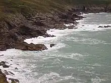 rocks jutting out into the sea.