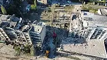 Aerial view of the damage with condition of the residential building (left) and Drujba hotel (right) after the attack.