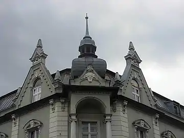 Spire on the roof and triangular gables