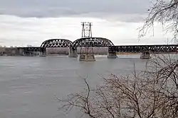 A bridge with two truss sections in the middle.