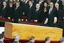 Pallbearers carry the casket of Pope John Paul II