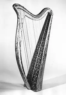 Black and white photograph of a small harp