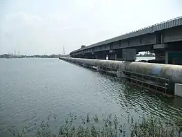 Porur lake with the Chennai Bypass bridge in the background