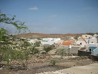 A picture shows residences amid rocky terrain in Povoação Velha, taken before the village sustained considerable damage in the hurricane.