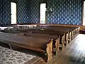 Unlike most churches, the pews are divided down the center by a wooden panel.