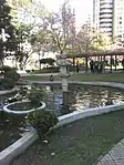 Stone-carved lantern in one of the ornamental lakes