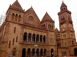 Italian Gothic architecture of Prag Mahal with clock tower on right