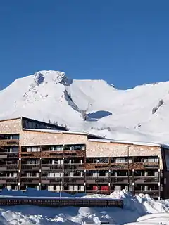 One of the main buildings in the centre of Praz de Lys. With the resort's highest point, Haut Fleury, and the chairlift leading up to it, in the background.