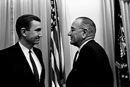 President Lyndon B. Johnson and Attorney General Ramsey Clark shaking hands.