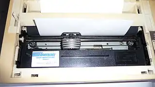 Large ink ribbon cartridge installed in a dot-matrix printer