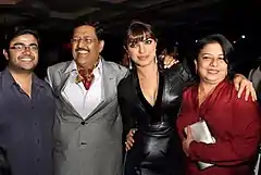 Priyanka Chopra and her family are looking towards the camera.