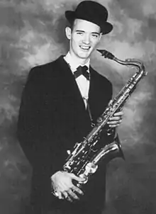 Marty Willis studio promo shot with saxophone and trademark derby