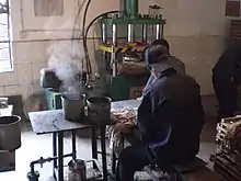 Steaming and pressing pu-erh tea into tea bricks