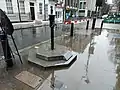 A wider image of the pump, with the red granite slab in view in the bottom-left corner.