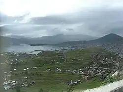 Puno, the capital of the region, and Lake Titicaca as seen from Puma Uta viewpoint