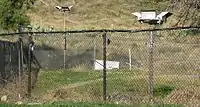 Fencing at Gold Base showing motion-activated lights.