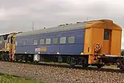 Crew car RZDY 106 (former Bluebird railcar 106 ‘Bittern’) on a Pacific National intermodal train at Snowtown, August 2023.