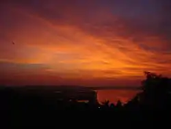 View of Ponte Conde de Linhares along the Mandovi River at dusk