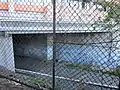 The south eastern entrance to the overbridge, under the building at 26 Lee Street.