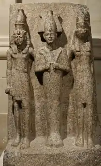 Statue of three men arm in arm