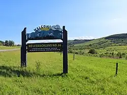 Ranchland landscape with welcome sign