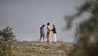 Model Raquel Zimmermann standing on the rim of Yellow House Canyon.