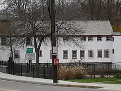 Seth Read's original water works building on Mumford River served as a 1777 grist mill, and an 1880s gun factory for single shot rifles, known as Bay State Arms. Today it houses a liquor store