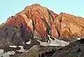 Northeast aspectNote the vein of white quartz rock, 60 to 70 feet wide, within the red slate.